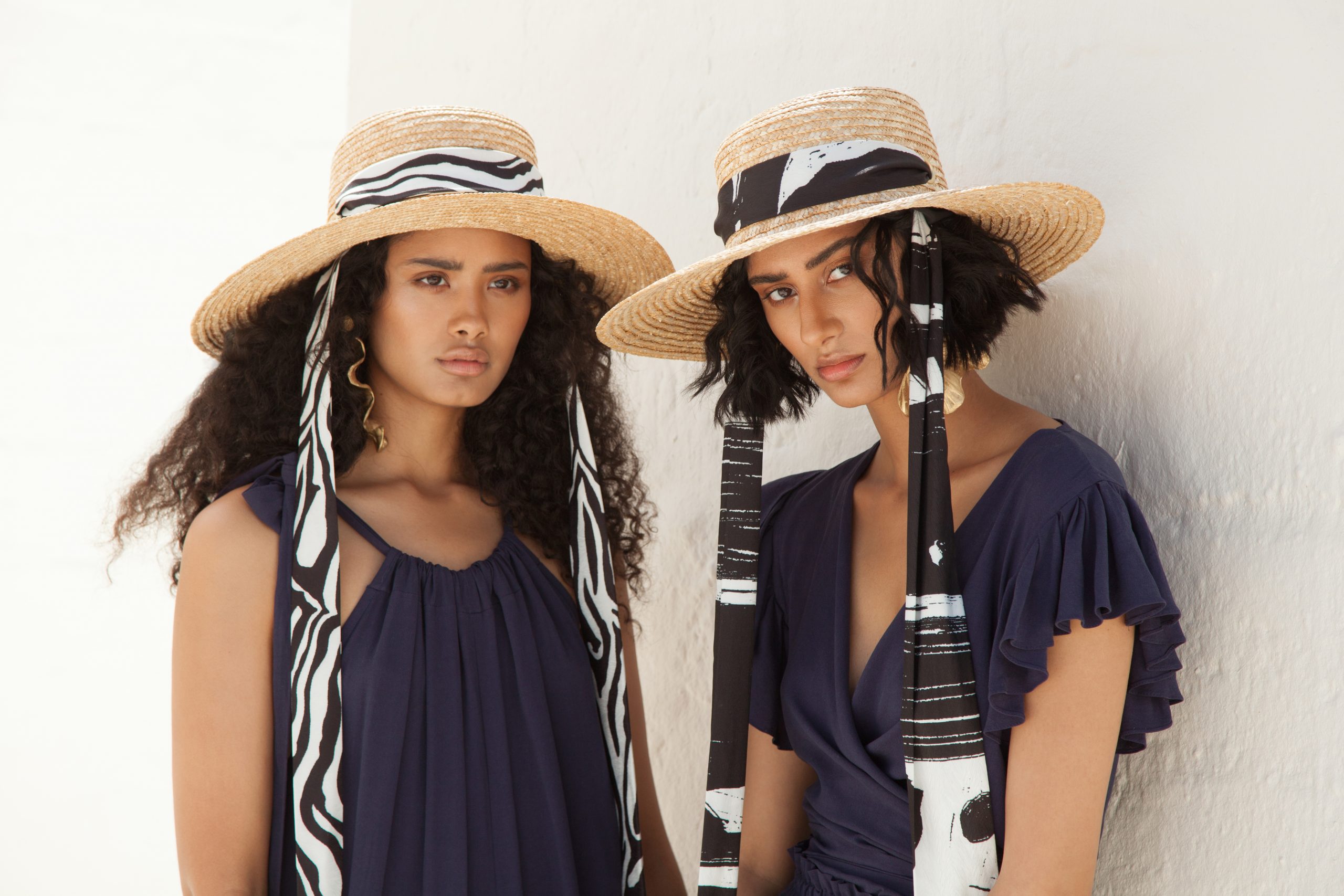Women in striped matching dresses